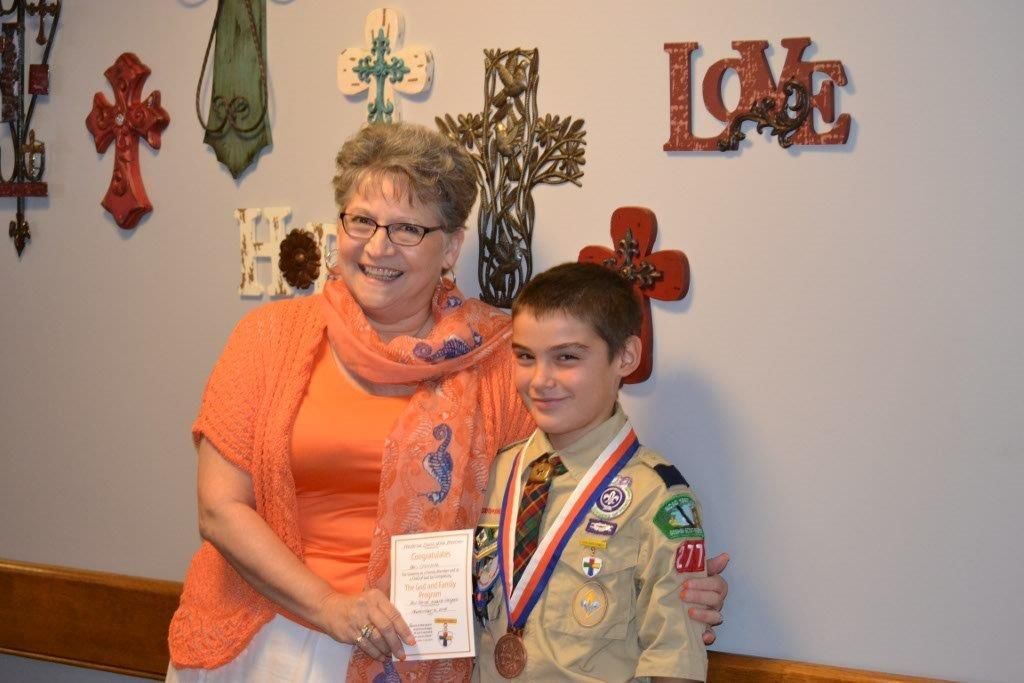 Earns God and Family Award